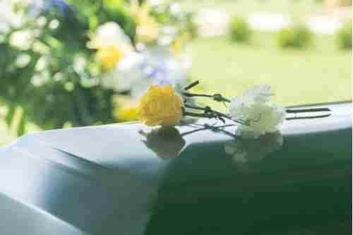 Roses on casket, concept of Belvedere Park wrongful death lawyer