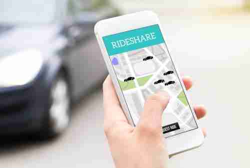 Rideshare picking up passenger, Decatur Uber accident lawyer concept