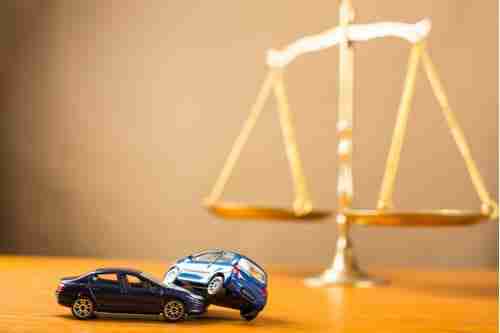 Druid Hills Car Accident Lawyer Concept, Toy Cars and Justice Scales
