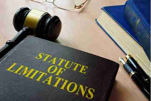 Statute of limitations law book and judge gavel