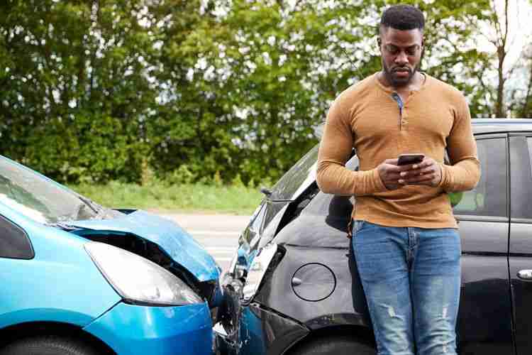 man calling car accident lawyer after an accident, why you need a lawyer