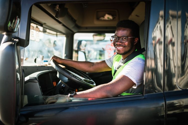 young man with cdl driving truck