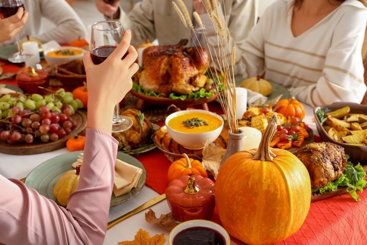 group of people having drinks over thanksgiving dinner, dui defense concept